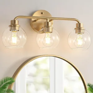 Farol de Pared para Vanity Watyo de 3 Luces, Acabado Brushed Brass, Pantallas de Vidrio Globo Transparente y Base E26